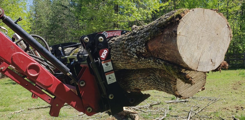 virnig compact tractor grapple carrying logs