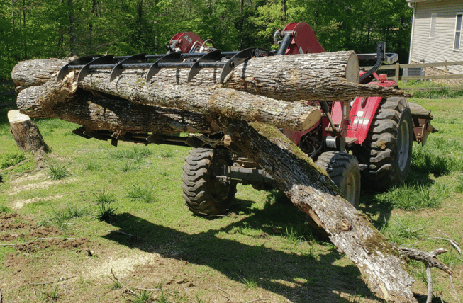 virnig compact tractor grapple hauling logs-1