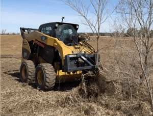 Virnig Tree Puller attachment and skid loader removing a tree
